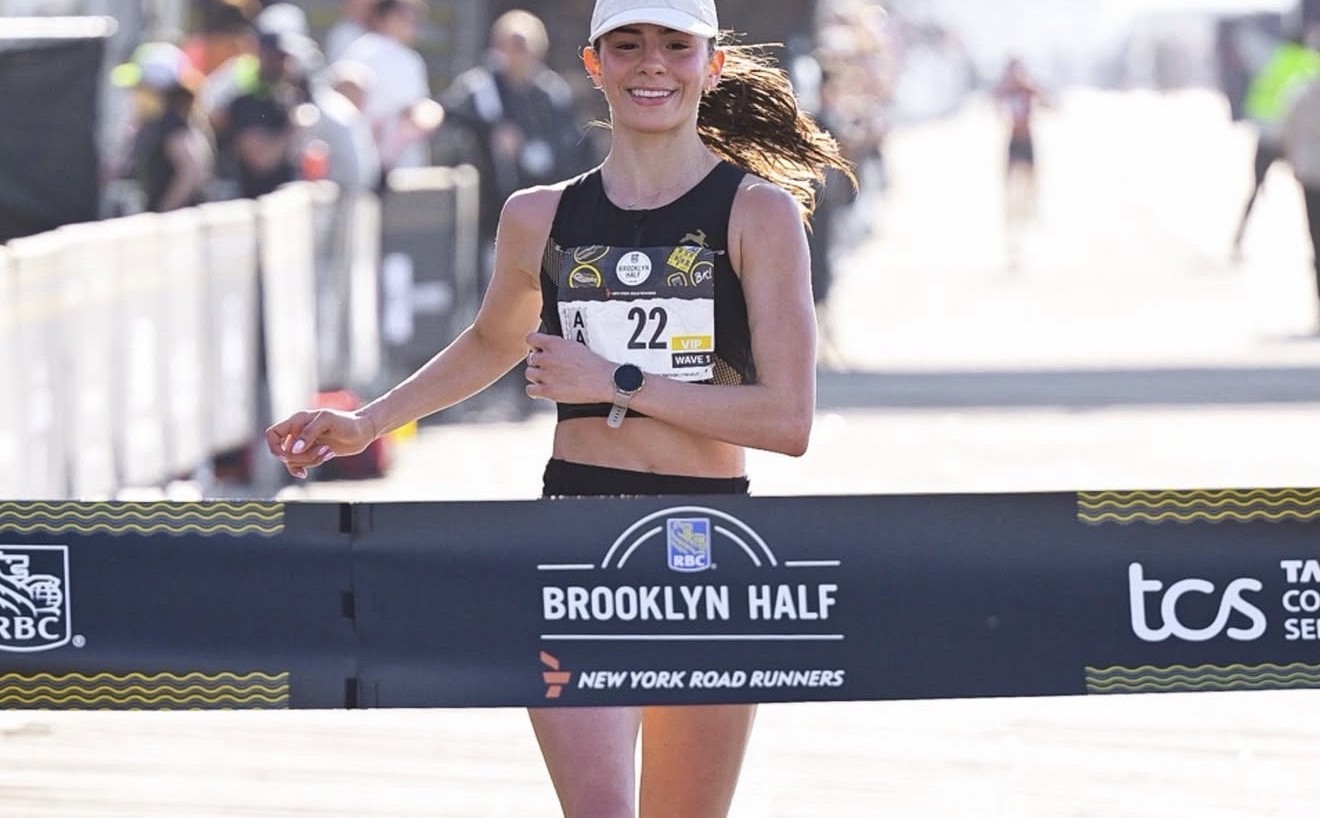 Fátima Alanís Miñarro crossing the finish line of the 2026 RBC Brooklyn Half as Women's Open Division Champion.